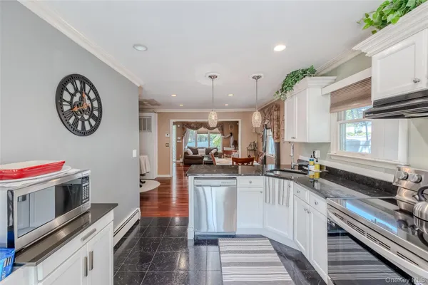 a kitchen with a stove and a microwave