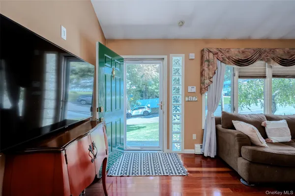 a living room with furniture and a window
