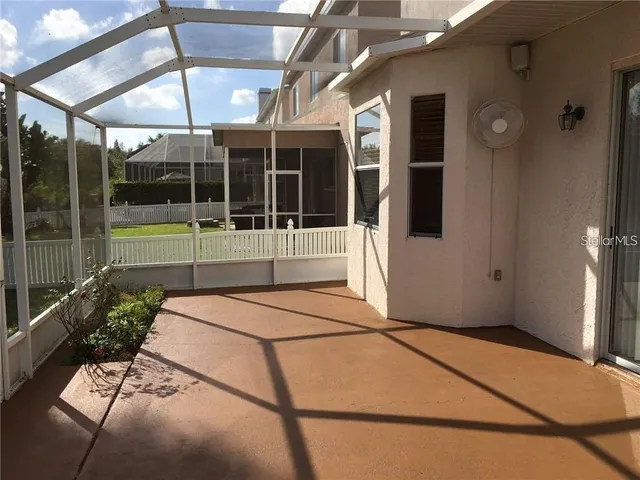 a view of house with backyard
