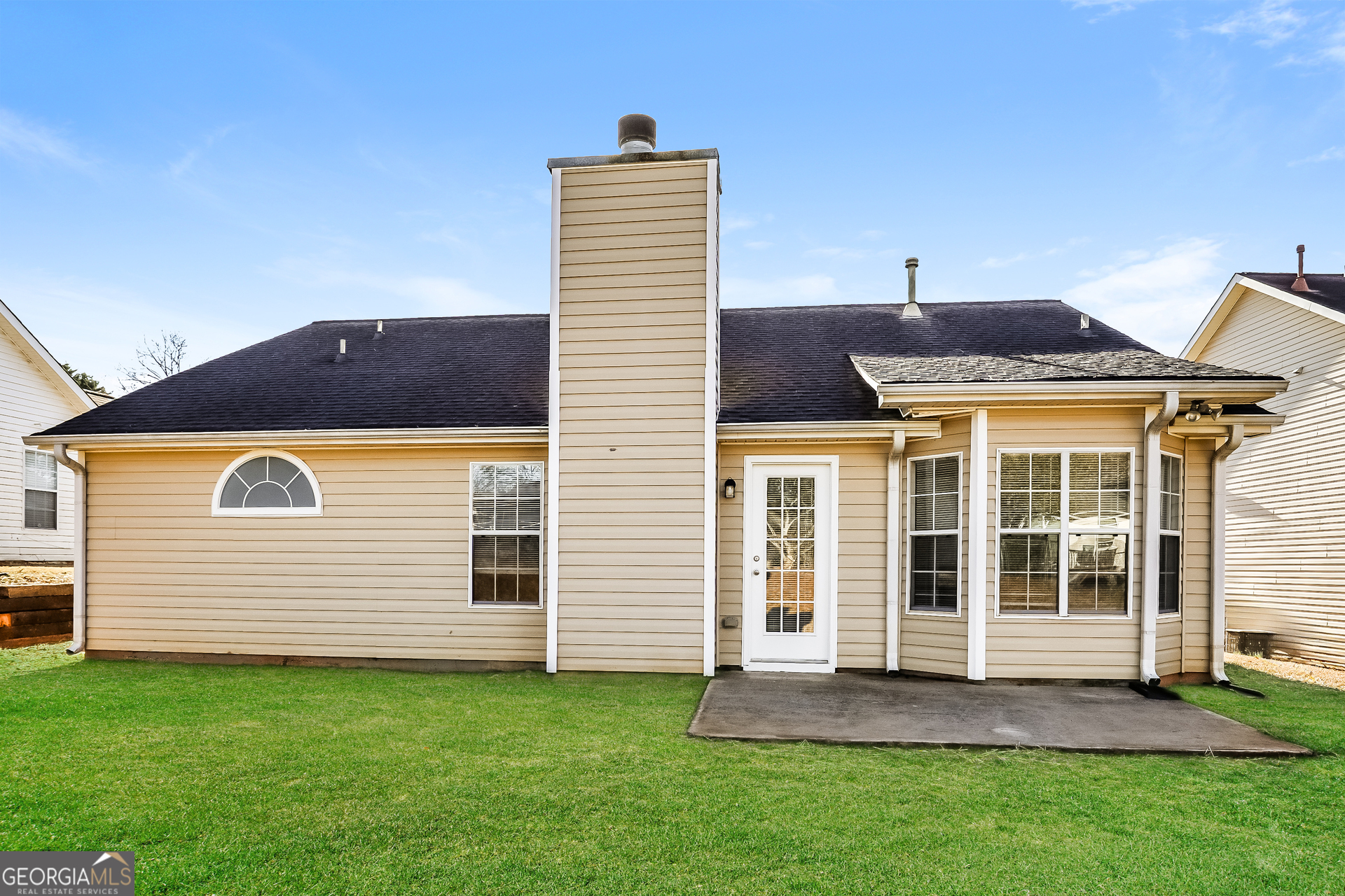 1915 Portwest Way Hampton, GA 30228 - Photo 15 of 16 a front view of a house with a garden