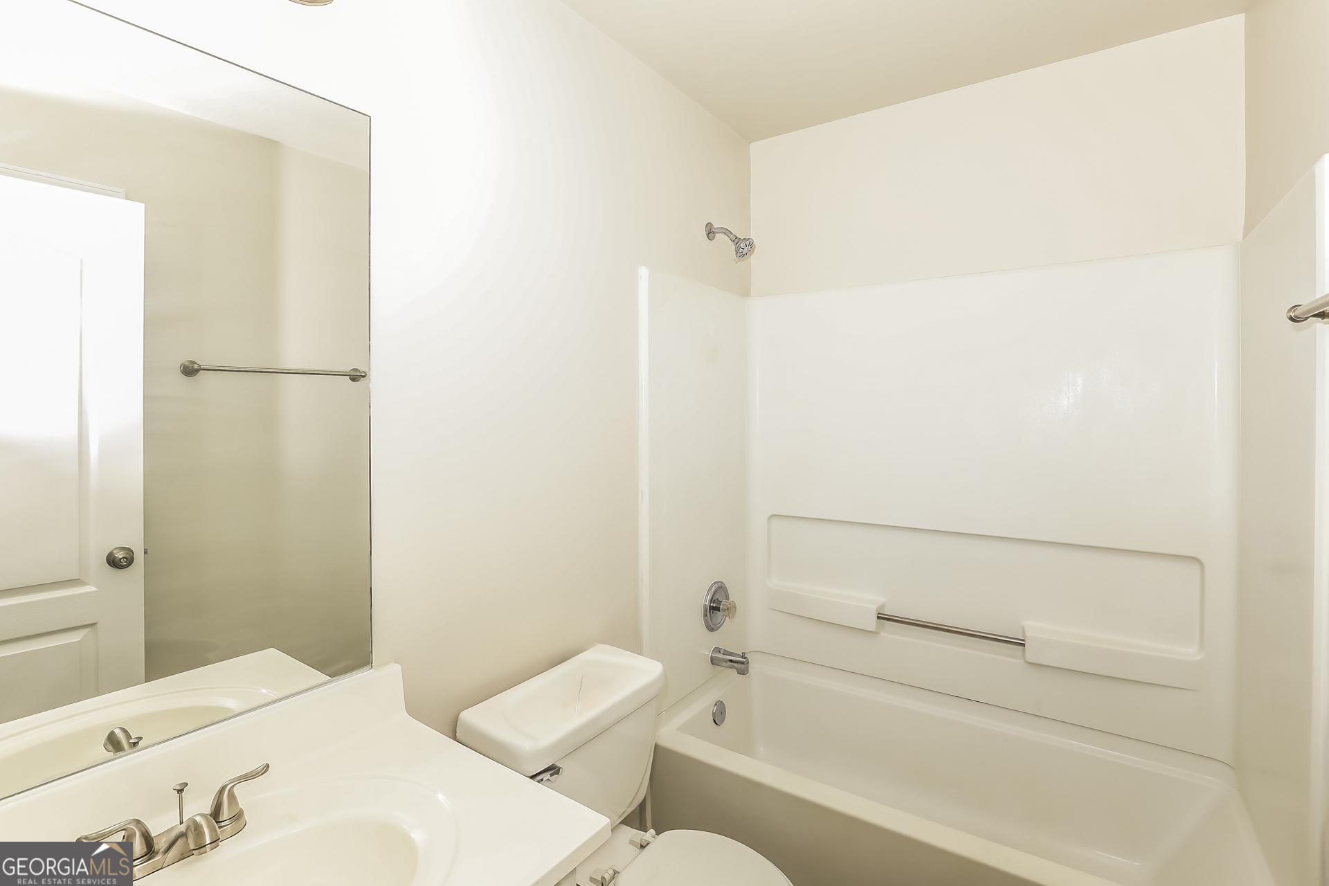 1915 Portwest Way Hampton, GA 30228 - Photo 9 of 16 a bathroom with a sink and a mirror