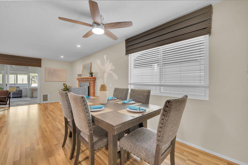 9430 Lake Canyon Road Santee, CA 92071 - Photo 12 of 52 a view of a dining room with furniture window and wooden floor