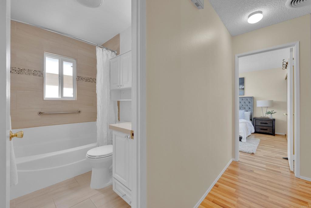 9430 Lake Canyon Road Santee, CA 92071 - Photo 19 of 52 a bathroom with a toilet a sink and a bathtub