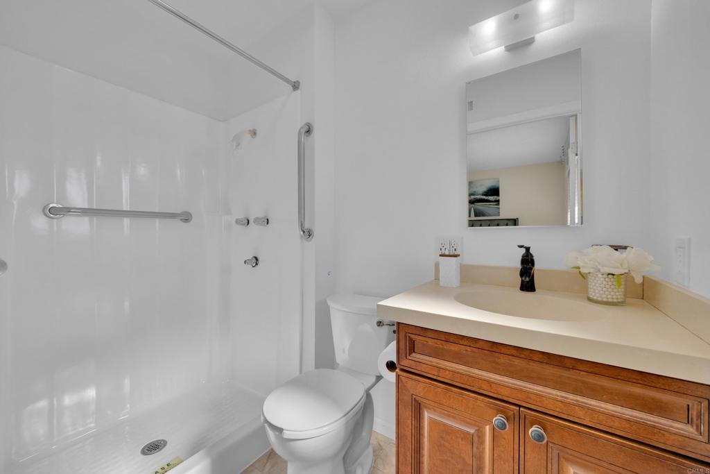 9430 Lake Canyon Road Santee, CA 92071 - Photo 26 of 52 a bathroom with a sink a toilet and shower