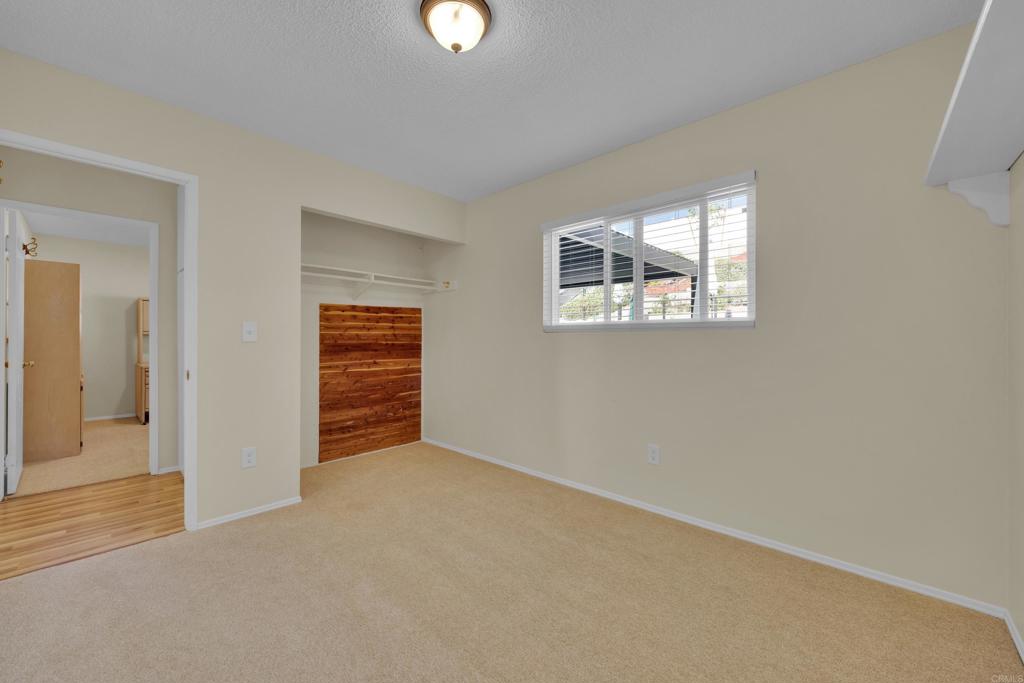 9430 Lake Canyon Road Santee, CA 92071 - Photo 31 of 52 an empty room with windows and closet