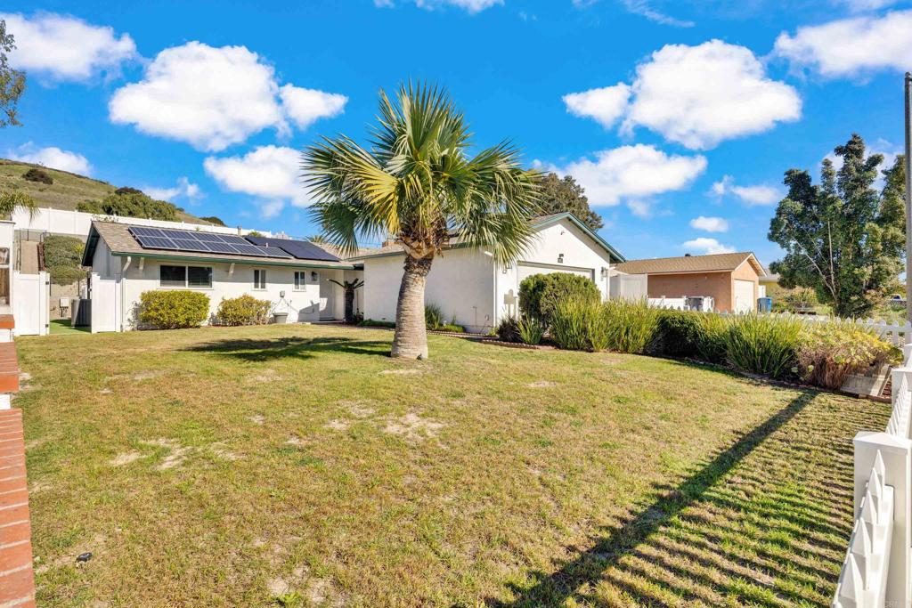 9430 Lake Canyon Road Santee, CA 92071 - Photo 5 of 52 a front view of a house with a yard