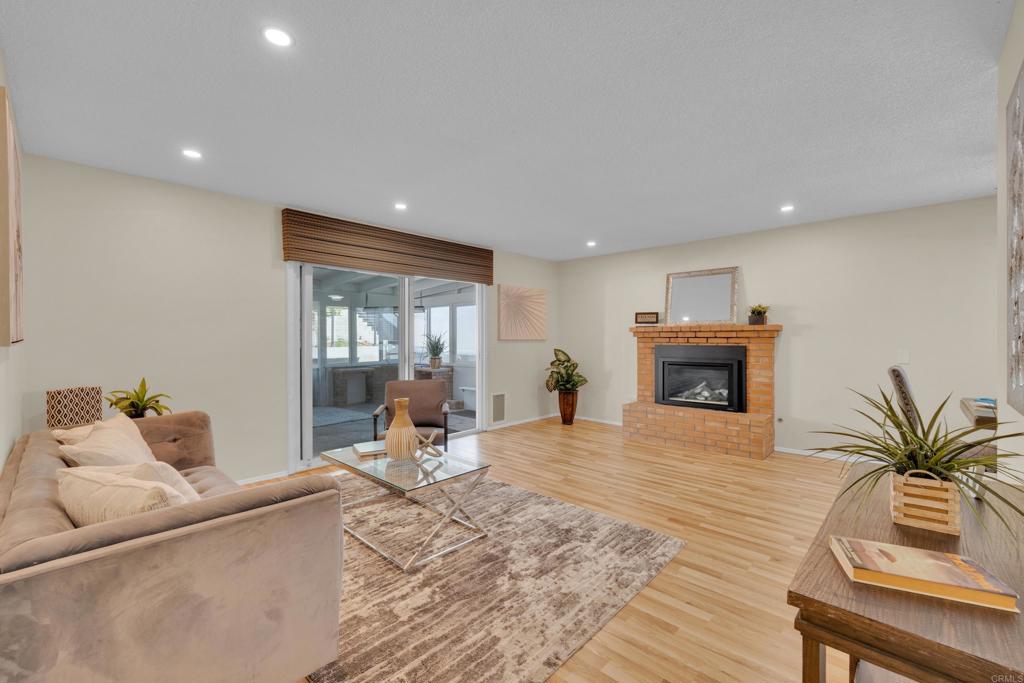 9430 Lake Canyon Road Santee, CA 92071 - Photo 10 of 52 a living room with furniture and a fireplace