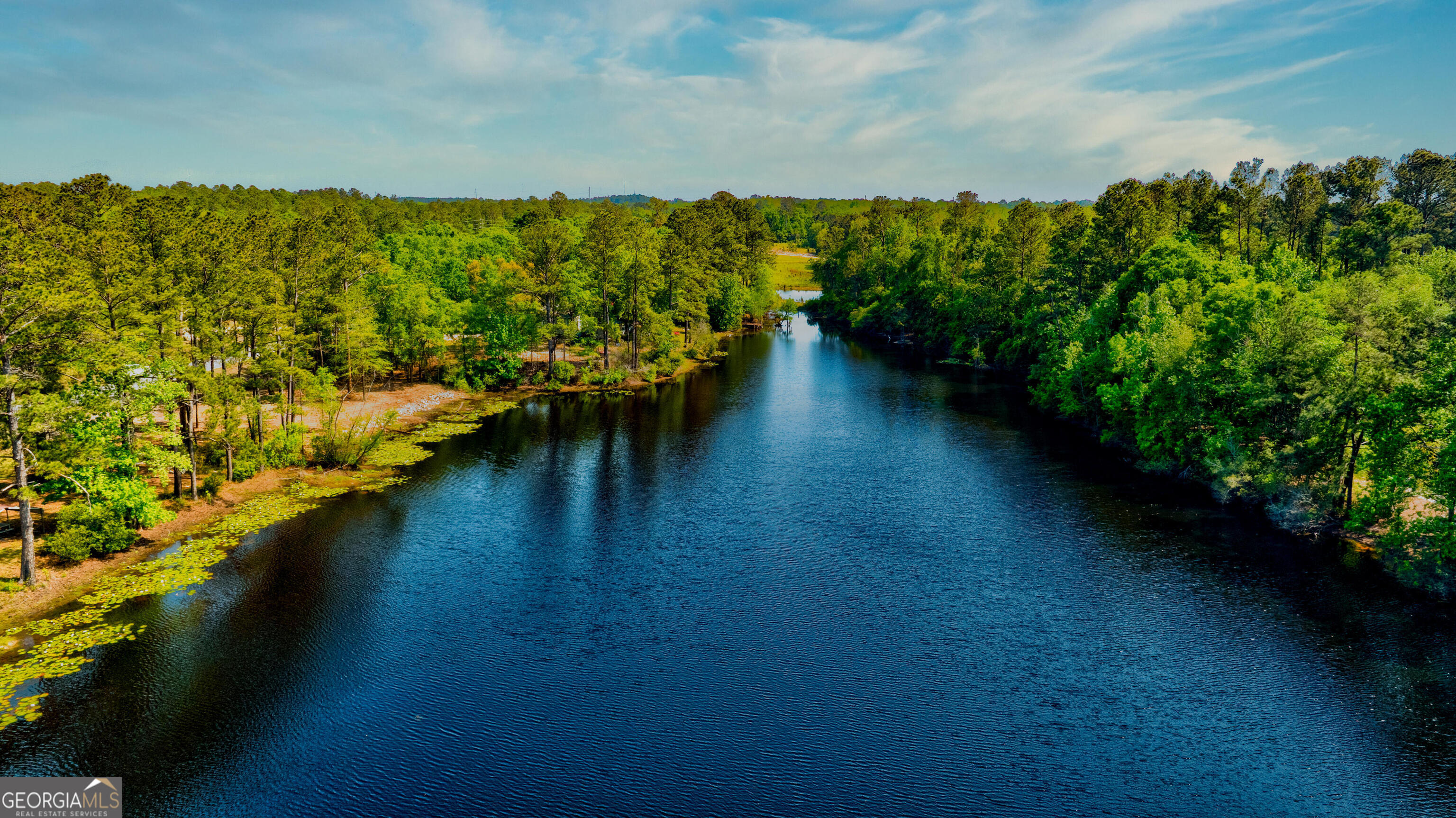 111 Edgewater Drive Bloomingdale, GA 31302 - Photo 11 of 11 a view of a lake with a mountain in the background