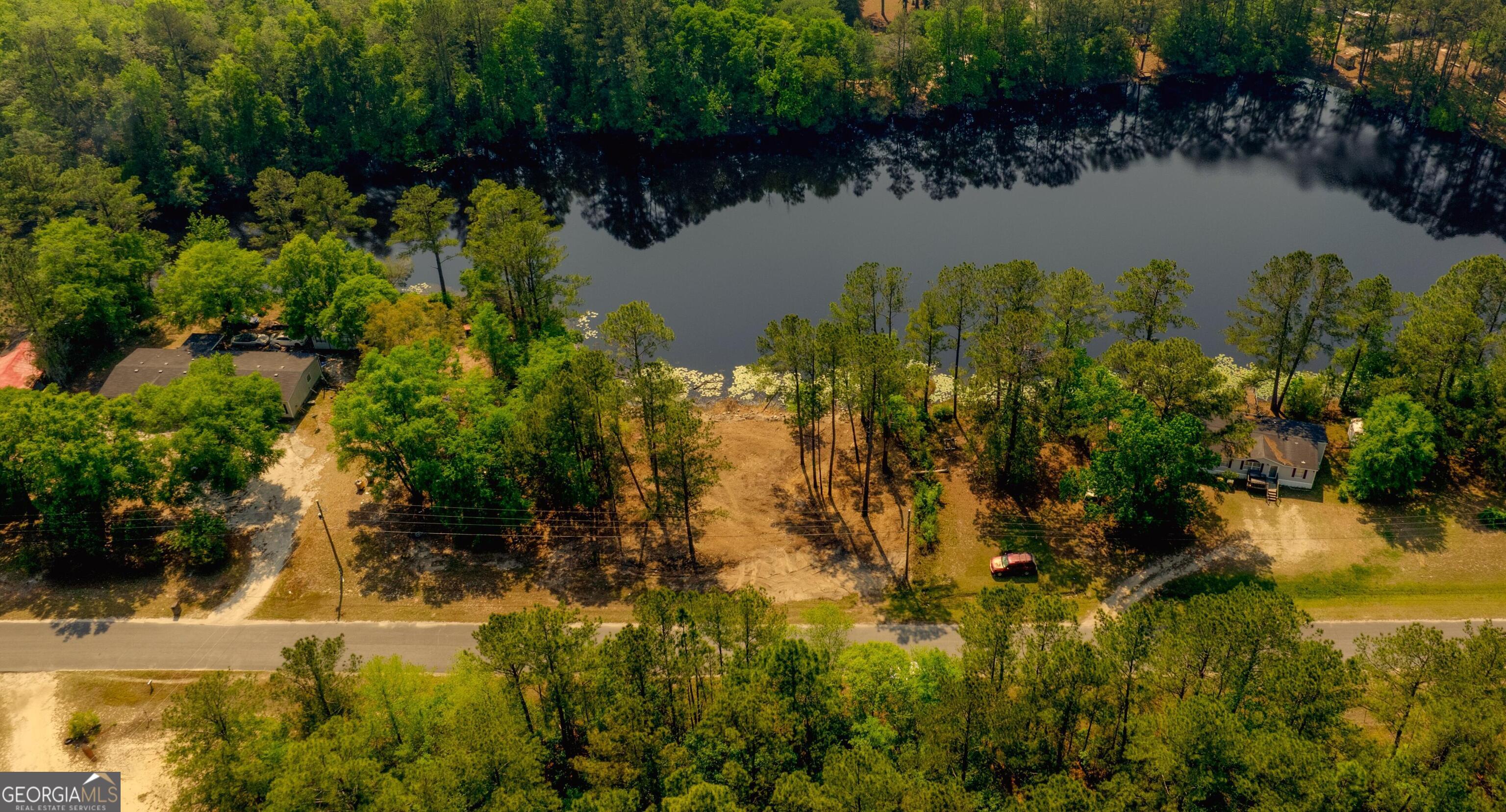 111 Edgewater Drive Bloomingdale, GA 31302 - Photo 2 of 11 a view of a lake with a lake