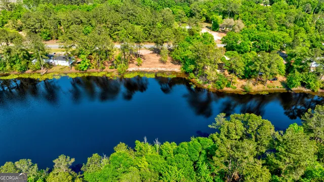 a view of a lake with a yard