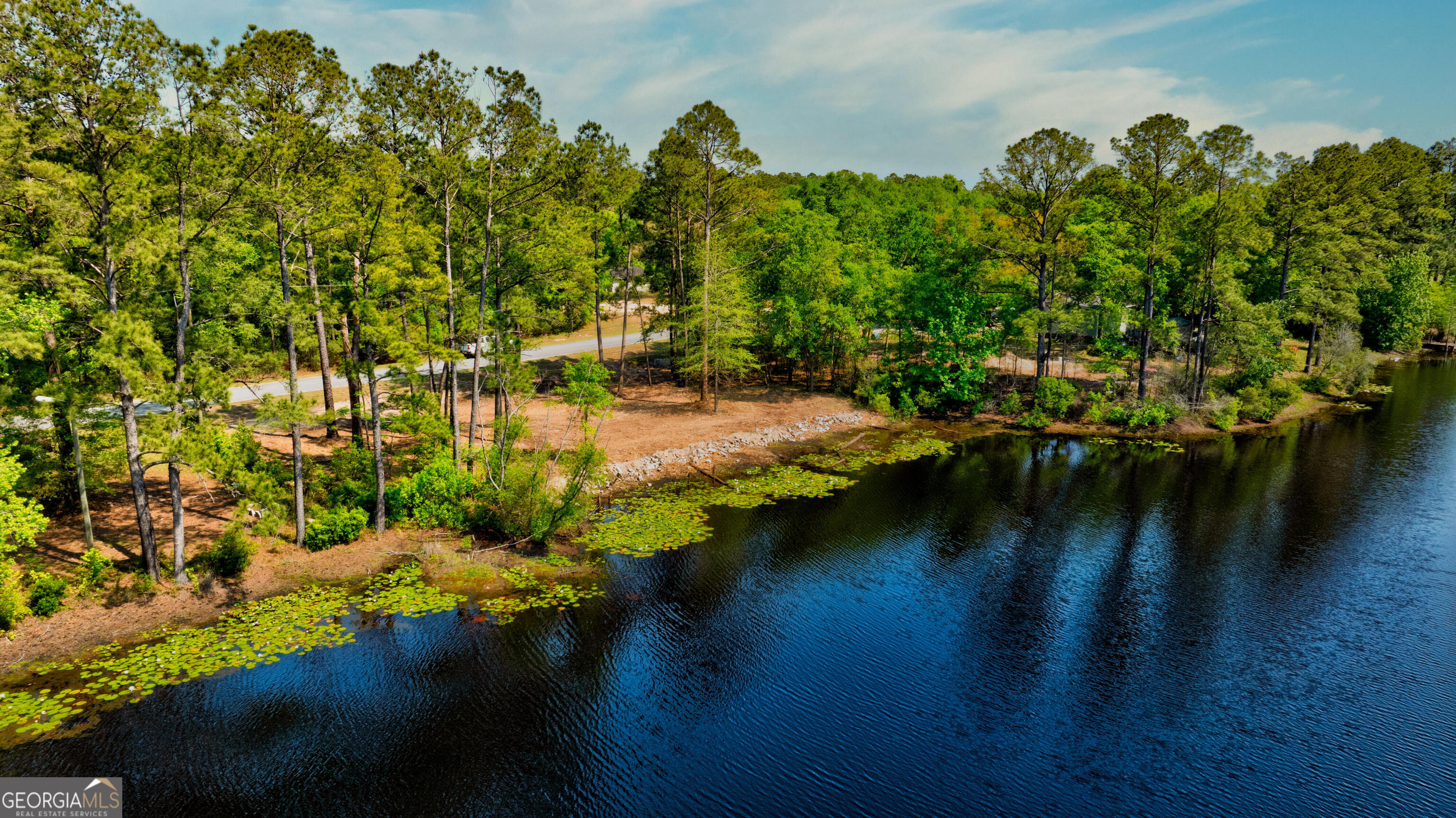 111 Edgewater Drive Bloomingdale, GA 31302 - Photo 8 of 11 a view of a lake with houses