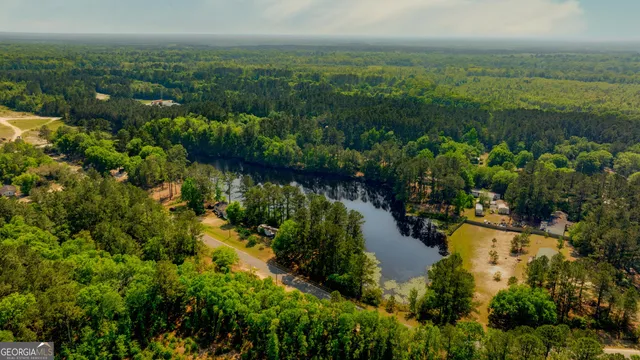 a view of a lake with green space