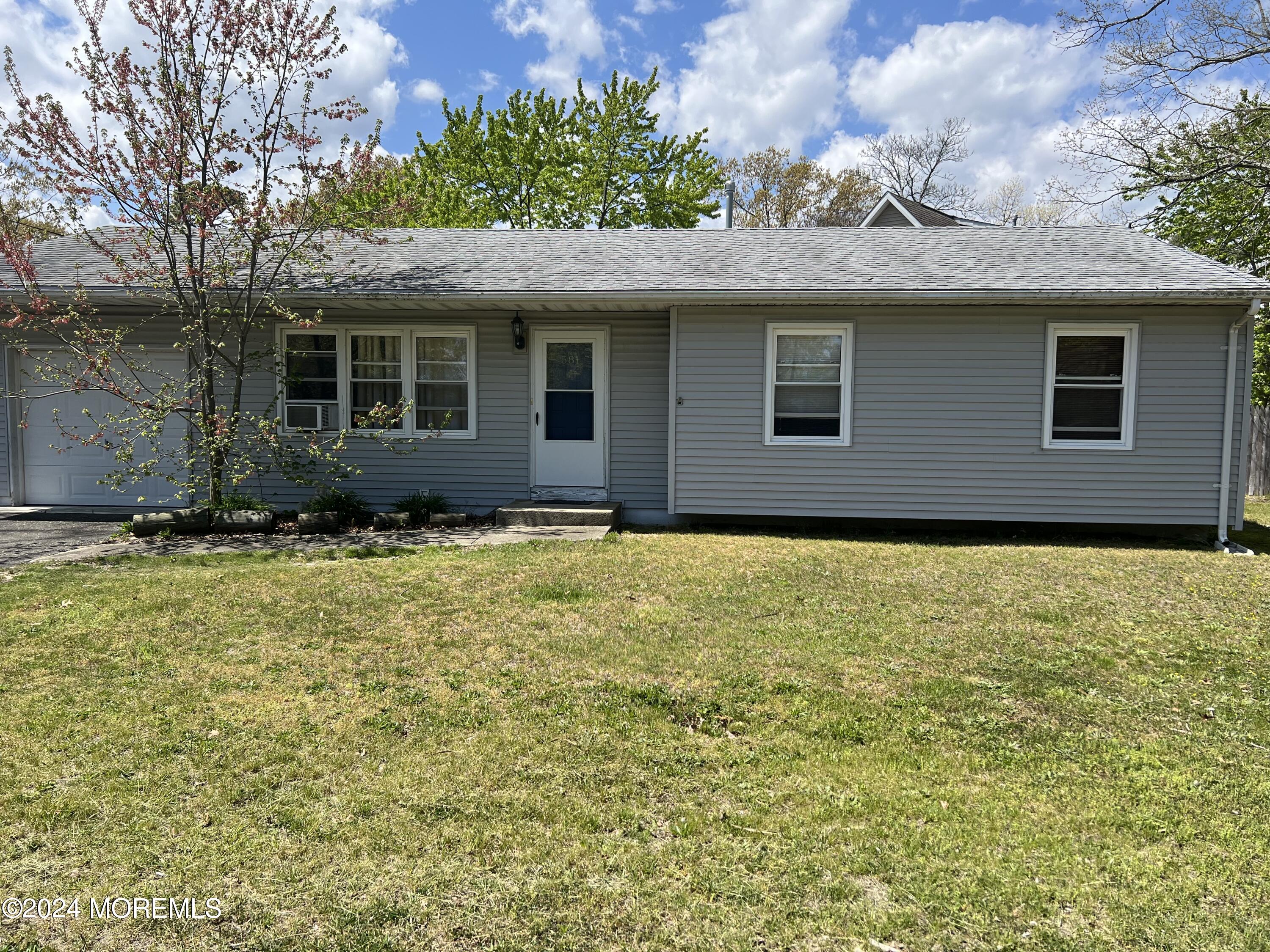 581 Drum Point Road Brick, NJ 08723 - Photo 1 of 6 a house view with a garden space