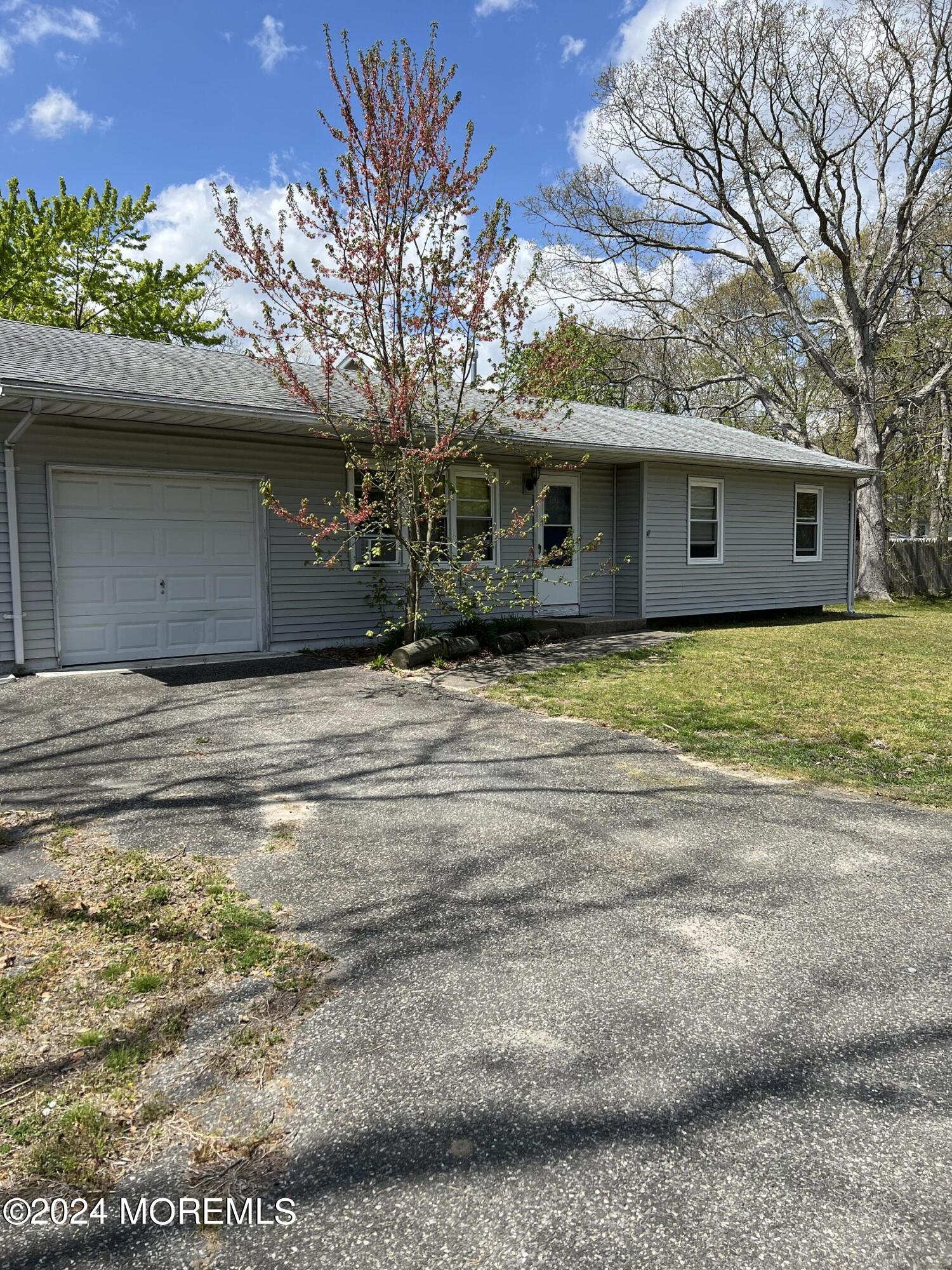 581 Drum Point Road Brick, NJ 08723 - Photo 3 of 6 a view of a house with a yard