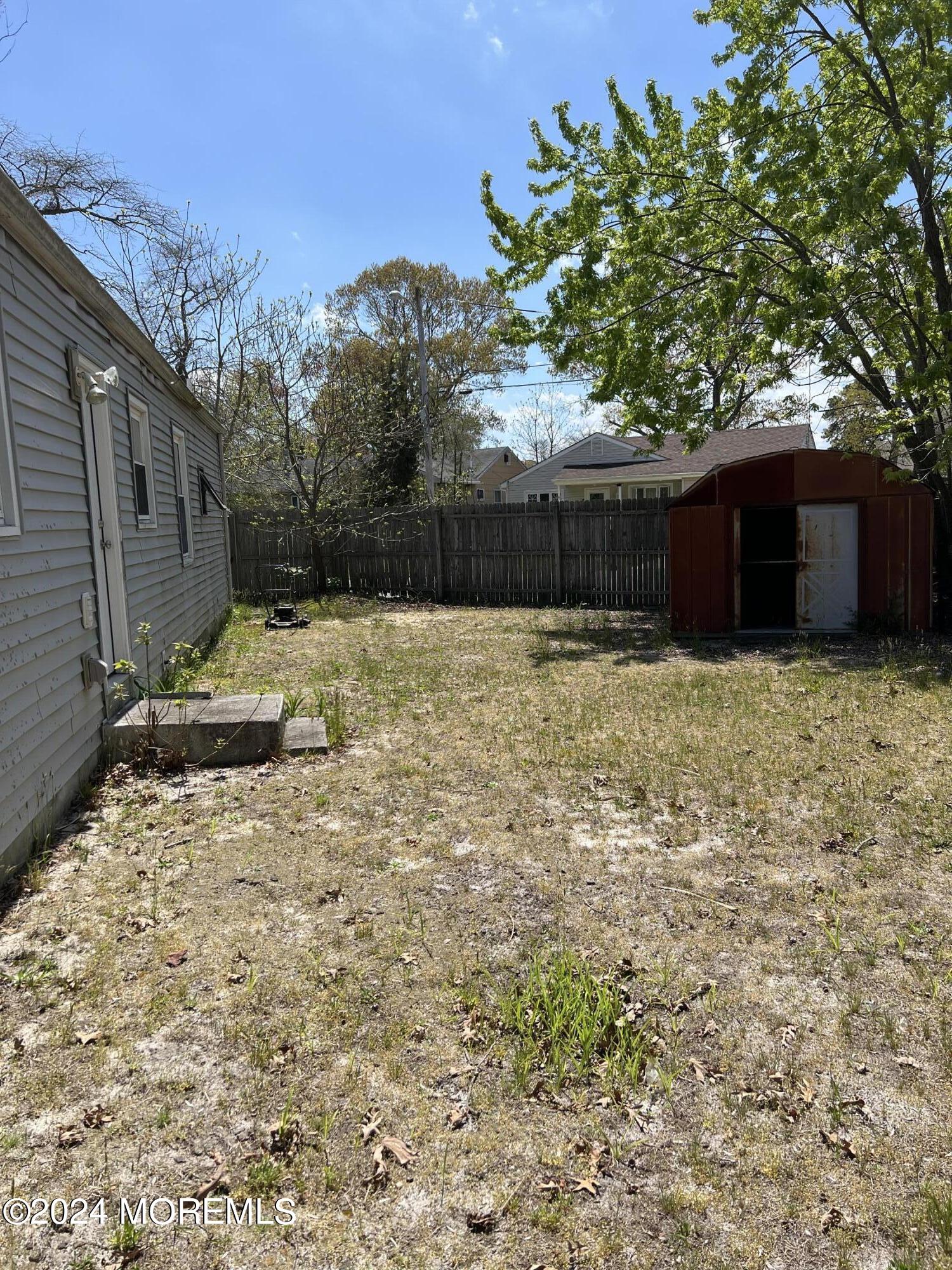 581 Drum Point Road Brick, NJ 08723 - Photo 5 of 6 a backyard of a house