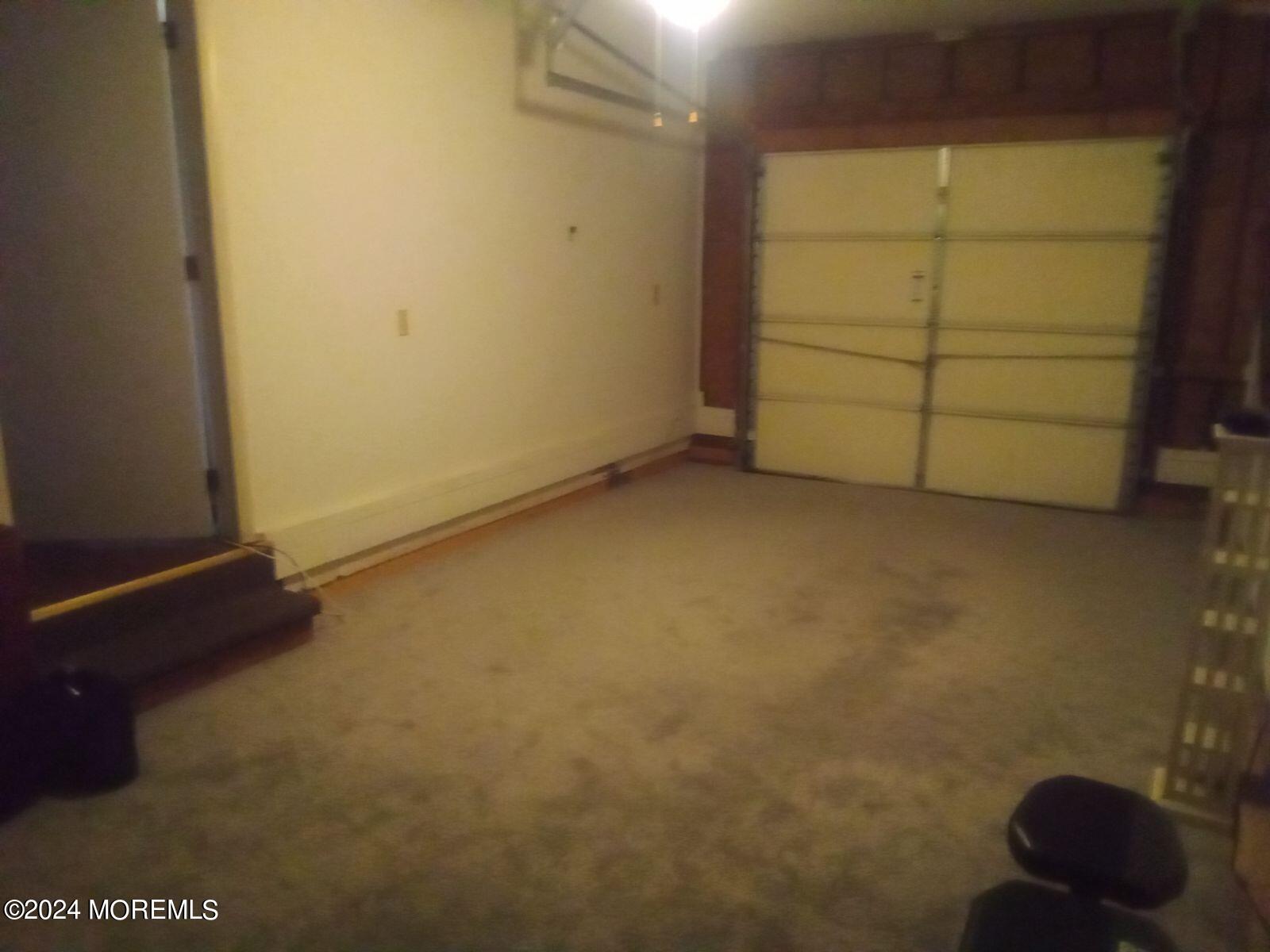 581 Drum Point Road Brick, NJ 08723 - Photo 6 of 6 an empty room with a bench