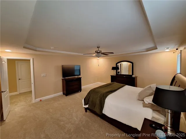 a spacious bathroom with a double vanity sink a mirror and a bathtub