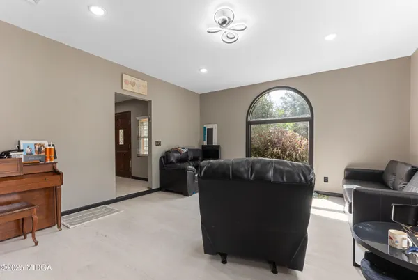 a living room with furniture and a large window