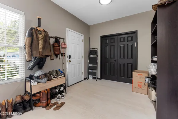 a bedroom with a bed and a dresser