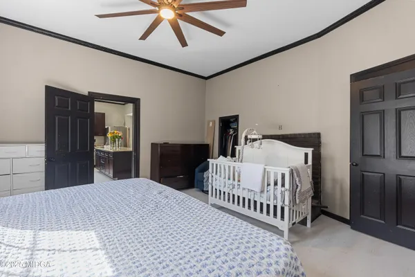 a bedroom with a bed and dresser