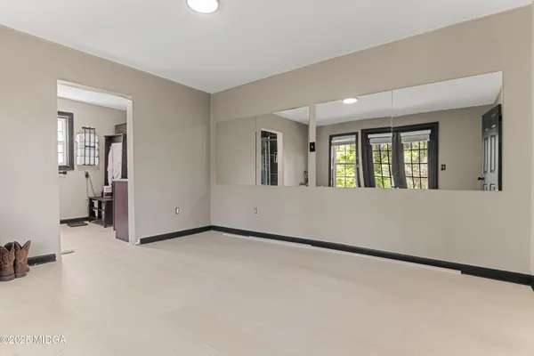a view of an empty room with a window
