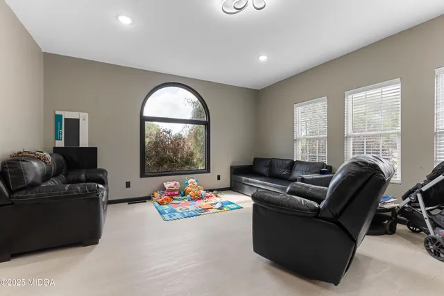 a kitchen with stainless steel appliances granite countertop a sink counter space cabinets and a large window