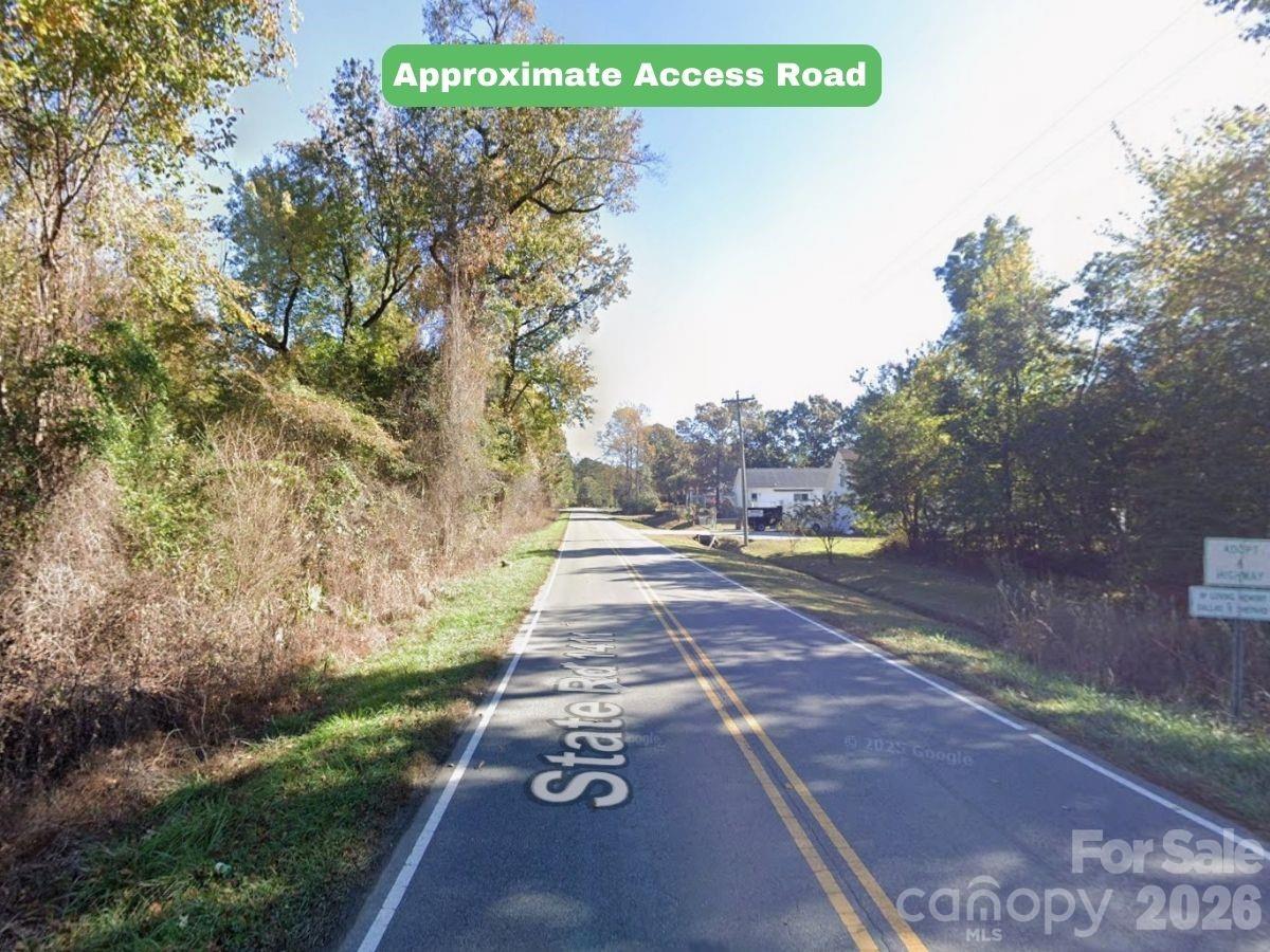 0 Roland Hills Burgaw, NC 28425 - Photo 4 of 21 a view of a street with a tree in the background