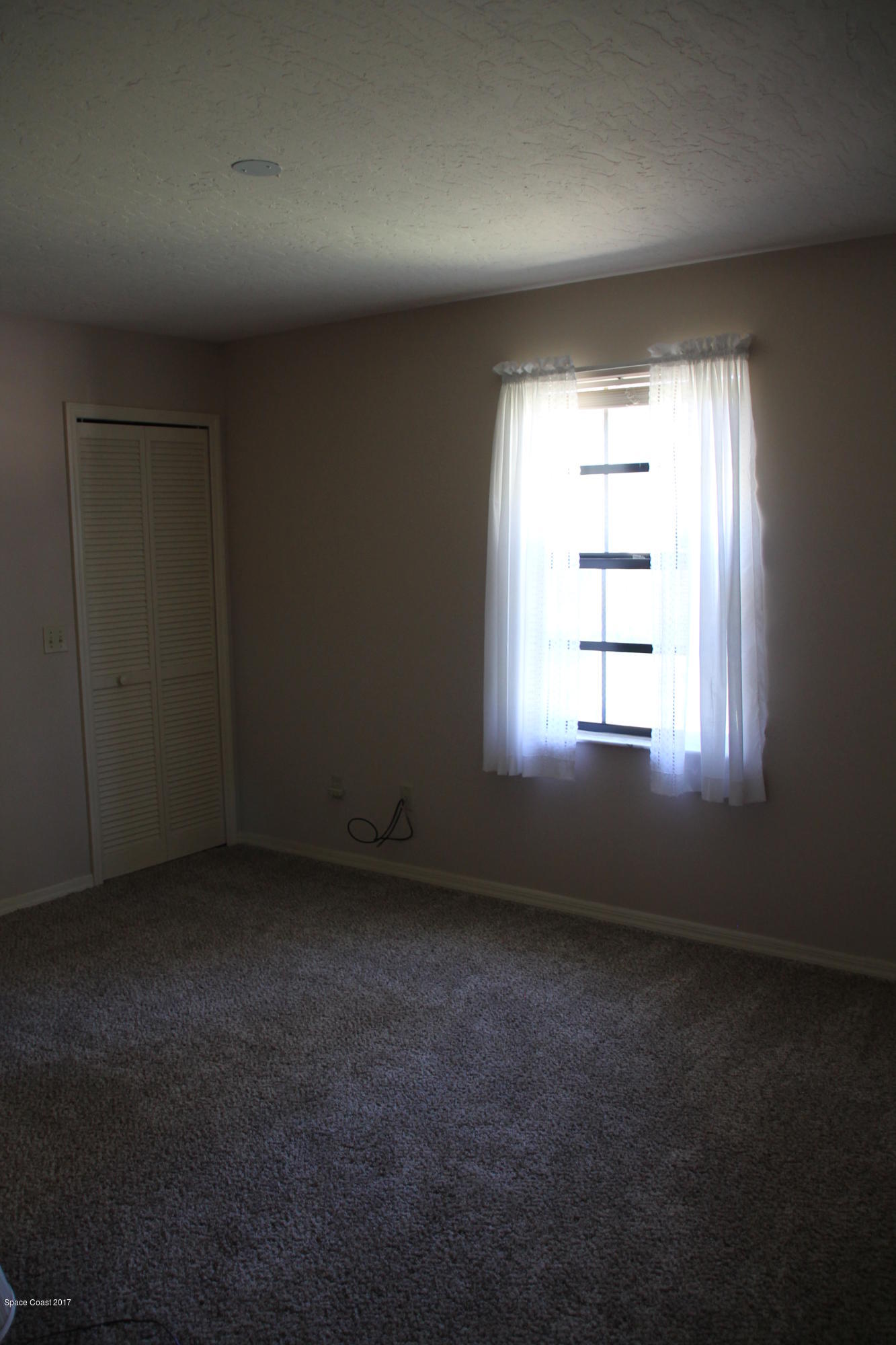 398 Hurst Road Northeast Palm Bay, FL 32907 - Photo 13 of 22 Guest bedroom