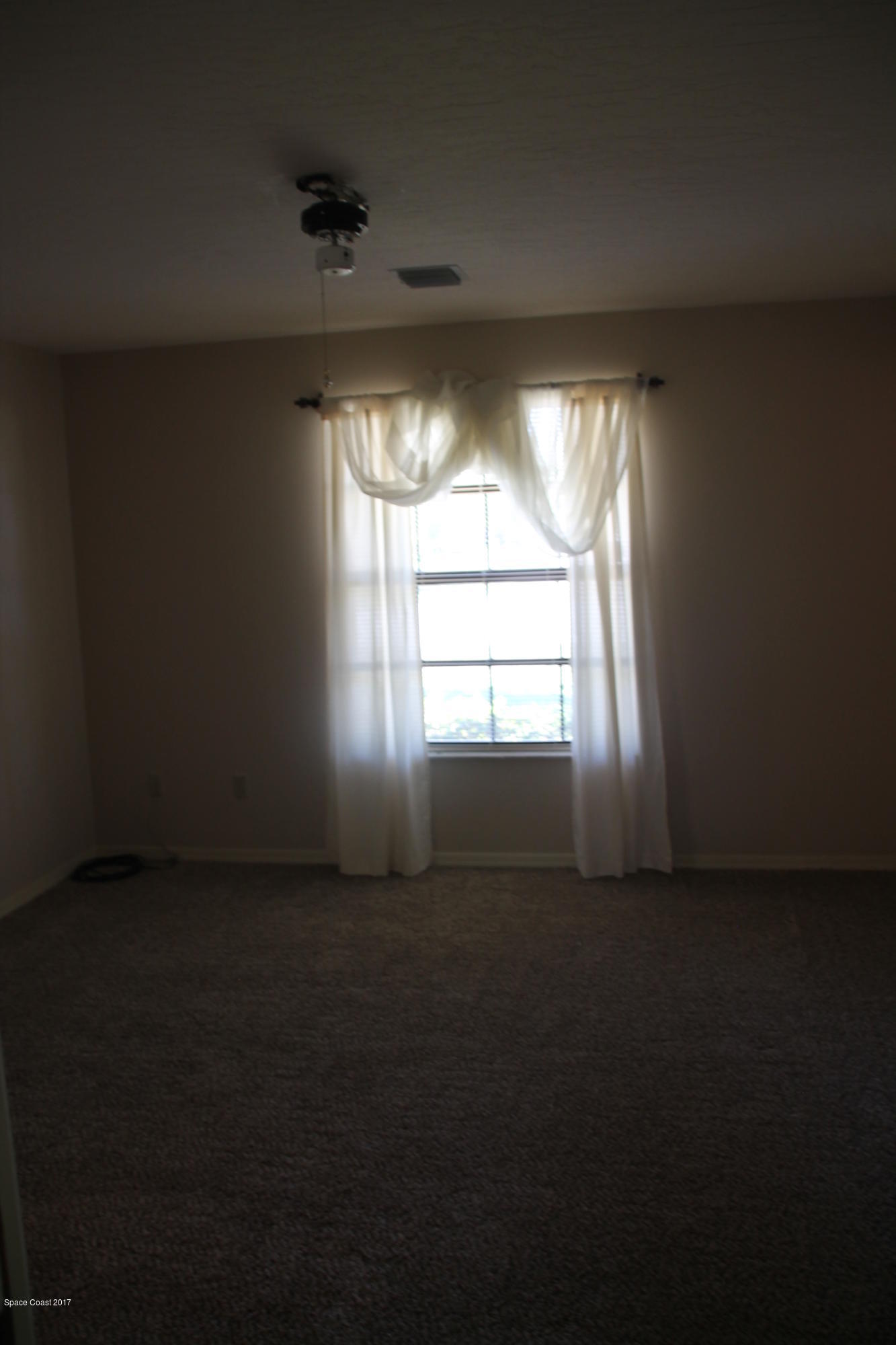 398 Hurst Road Northeast Palm Bay, FL 32907 - Photo 16 of 22 Master bedroom