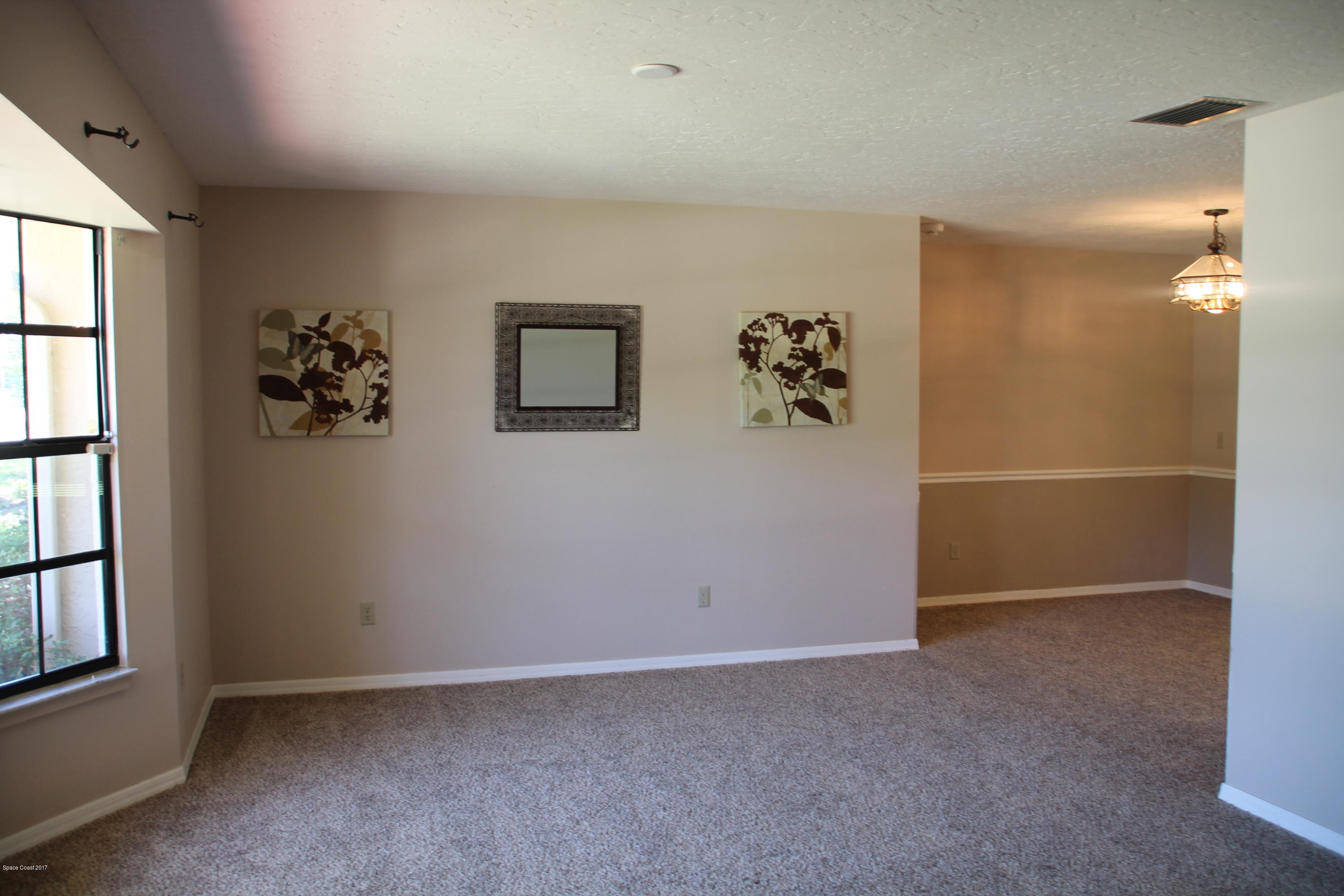 398 Hurst Road Northeast Palm Bay, FL 32907 - Photo 9 of 22 Living Room