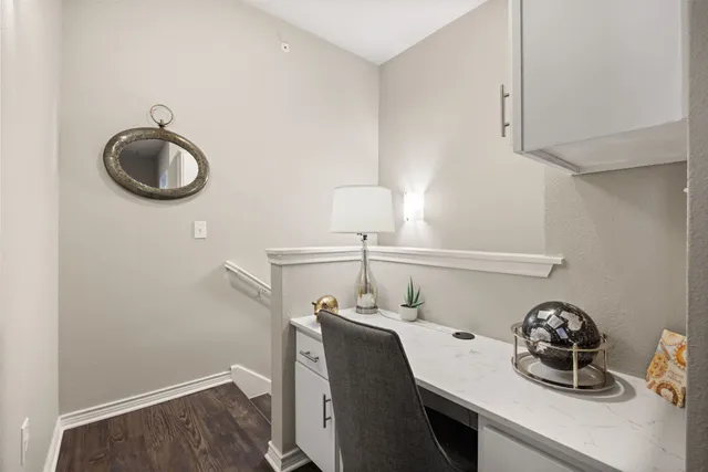 a bathroom with a sink and a stove with wooden floor