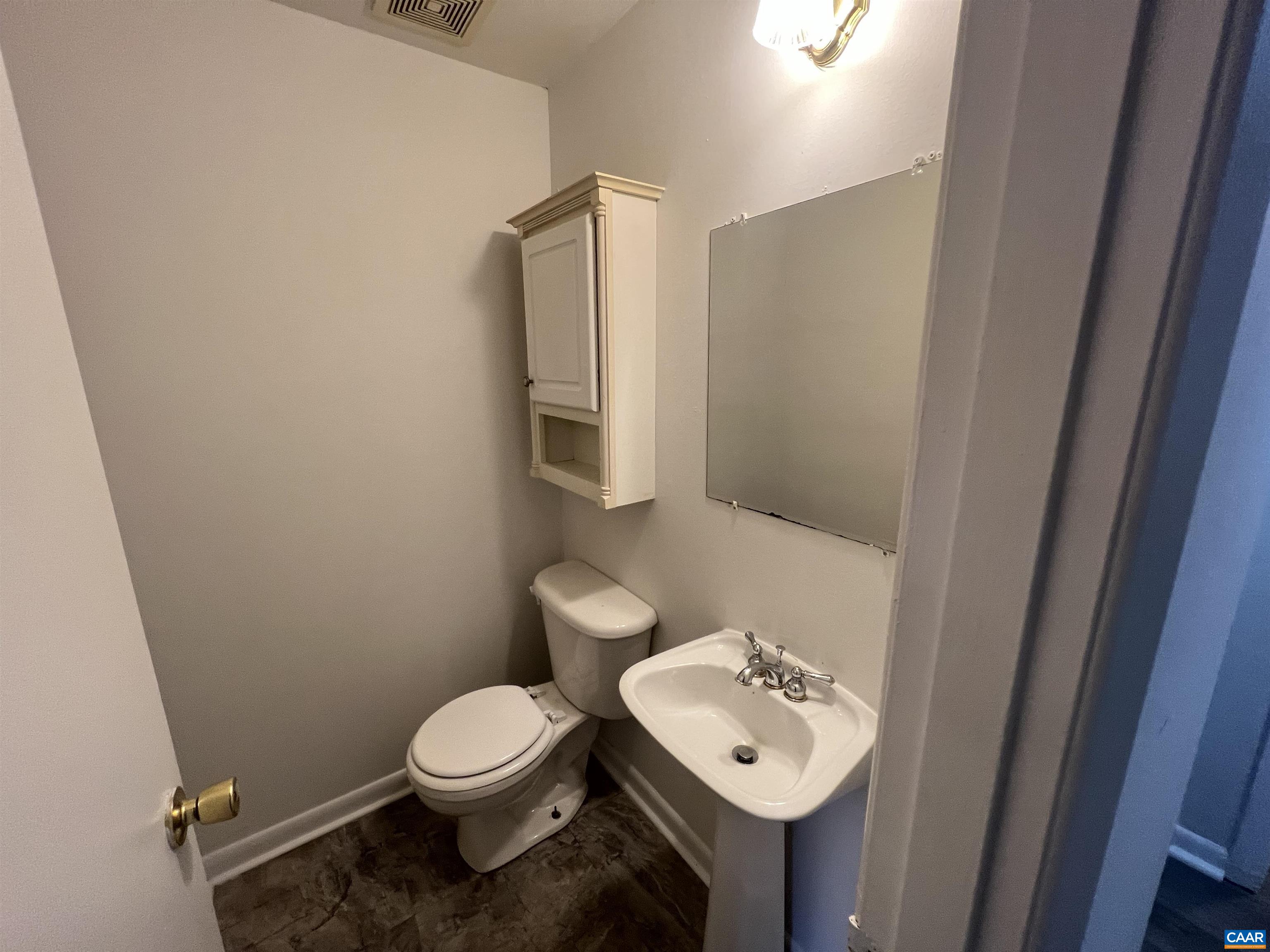 124 Middlesex Drive, Unit B Charlottesville, VA 22901 - Photo 18 of 38 a bathroom with a toilet a sink and mirror