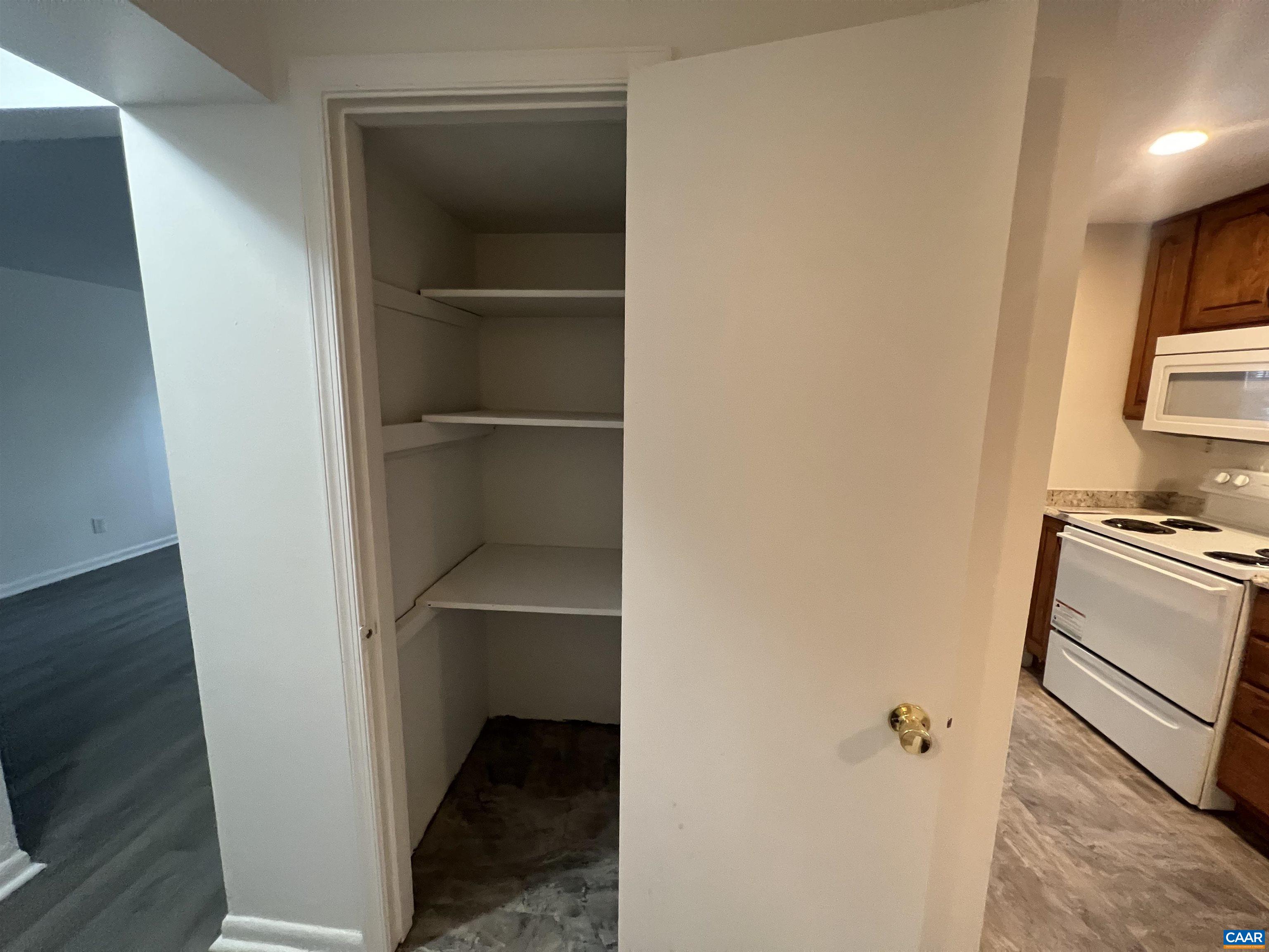 124 Middlesex Drive, Unit B Charlottesville, VA 22901 - Photo 19 of 38 a room with a closet and a stove