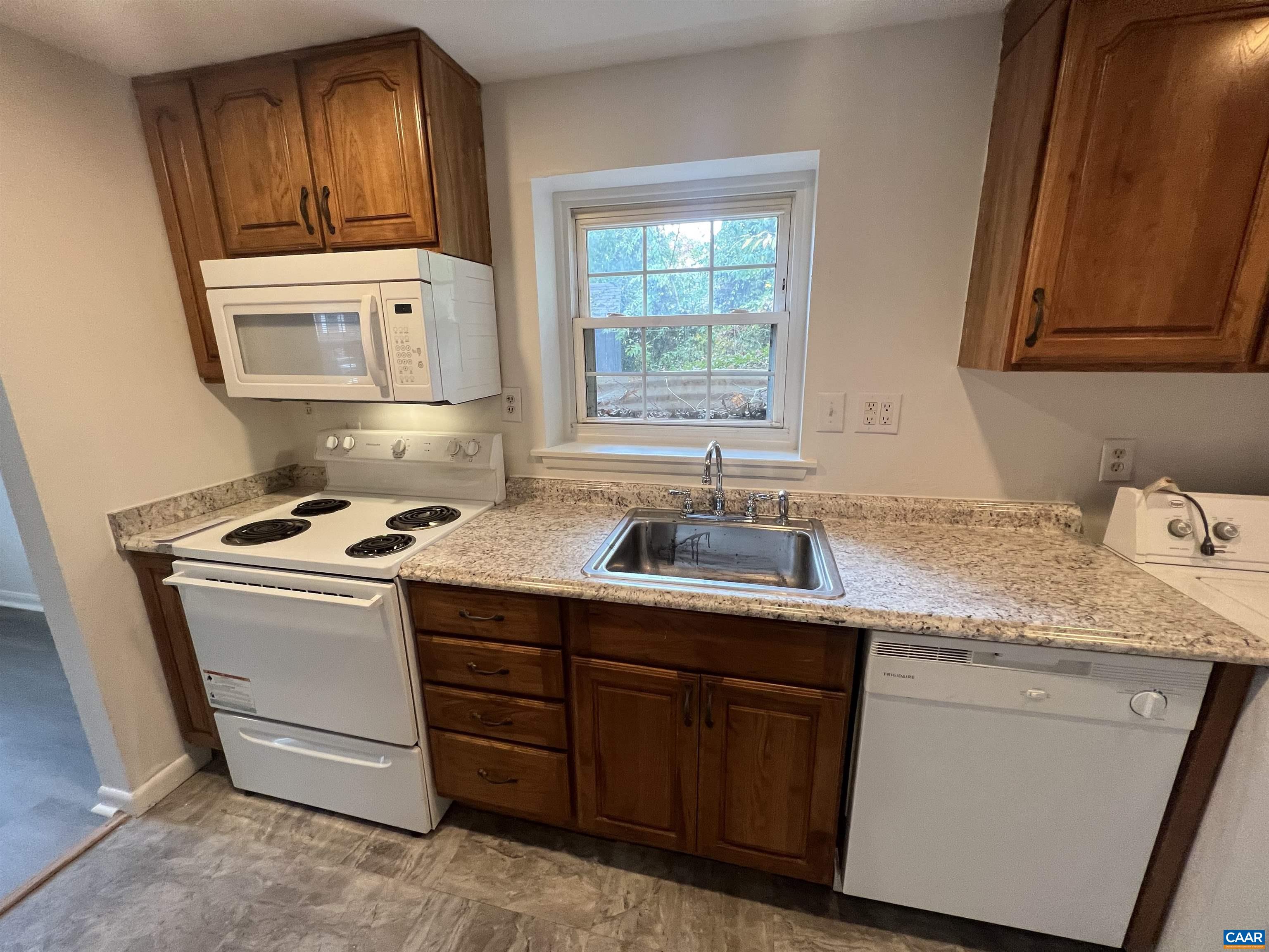 124 Middlesex Drive, Unit B Charlottesville, VA 22901 - Photo 3 of 38 a kitchen with stainless steel appliances granite countertop a sink stove and cabinets