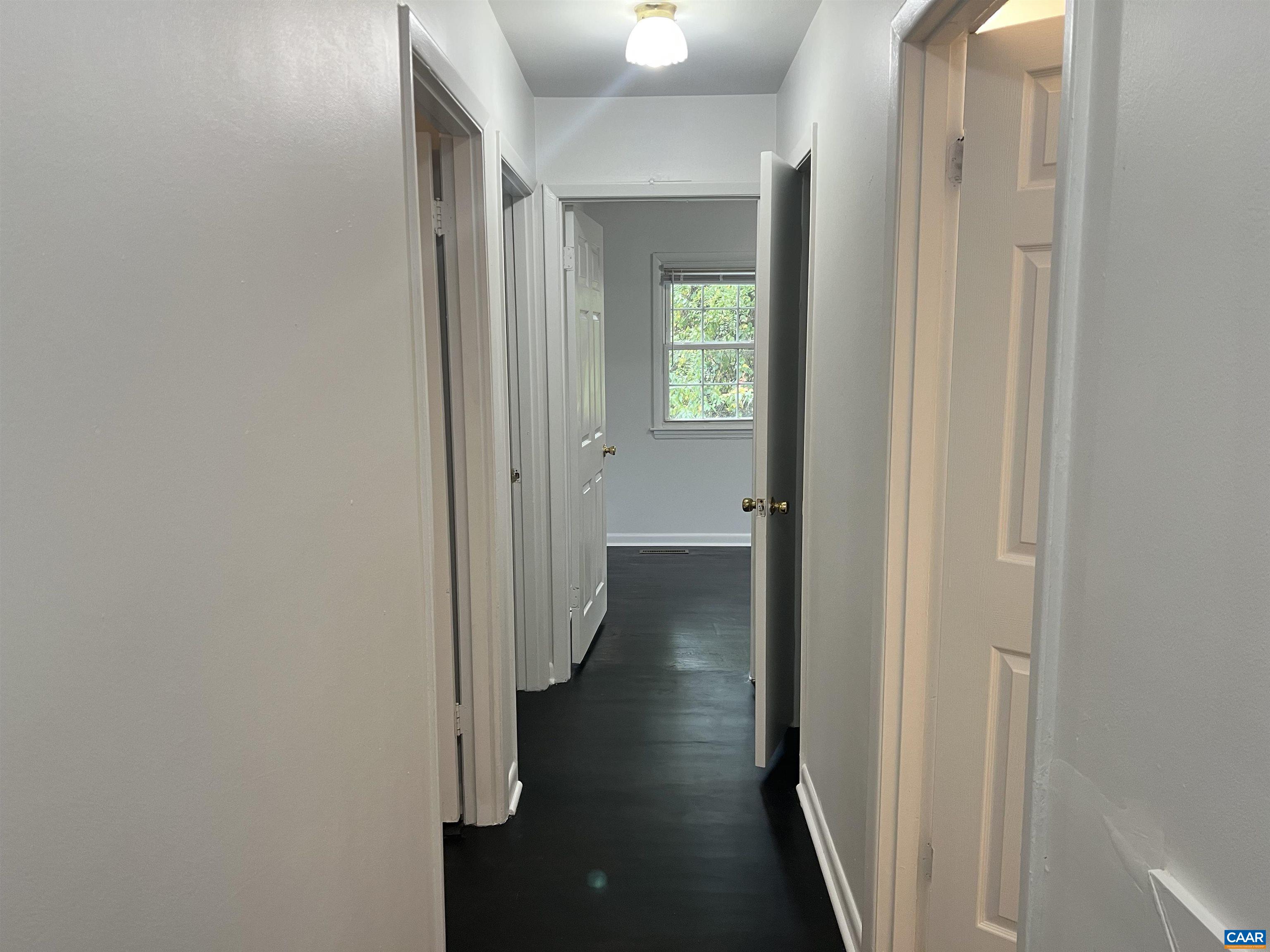 124 Middlesex Drive, Unit B Charlottesville, VA 22901 - Photo 36 of 38 a view of a hallway with a wooden floor