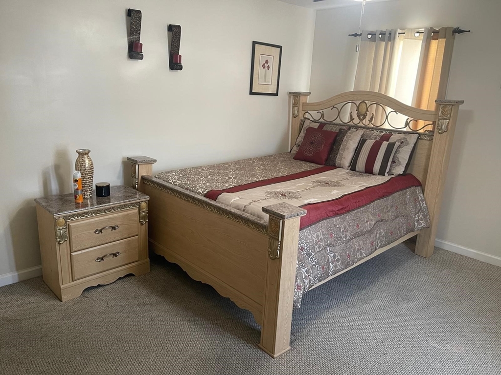 19 Annies Way Springfield, MA 01119 - Photo 3 of 41 a bedroom with a bed and a dresser