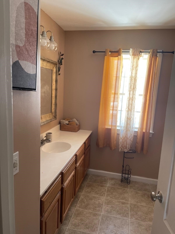 19 Annies Way Springfield, MA 01119 - Photo 8 of 41 a bathroom with a granite countertop sink and a mirror