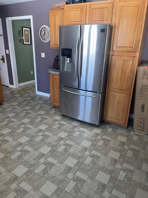 19 Annies Way Springfield, MA 01119 - Photo 10 of 41 a view of a refrigerator in kitchen and windows