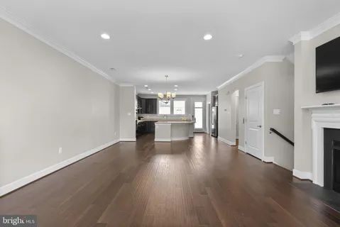 a view of kitchen and dining room with wooden floor