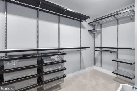 a view of an empty walk in closet