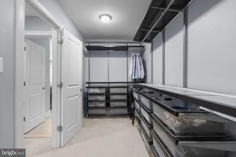 a spacious bathroom with a granite countertop bathtub sink and mirror
