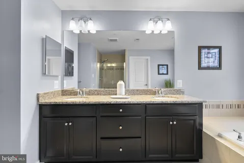 a spacious bathroom with a shower and a bathtub