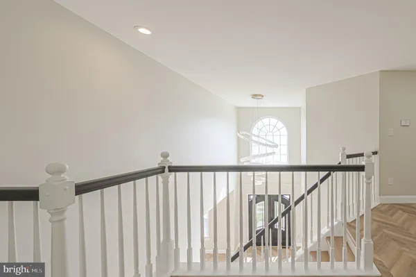 a view of staircase with rug