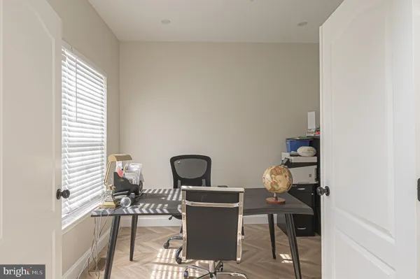 a work room with furniture and a window