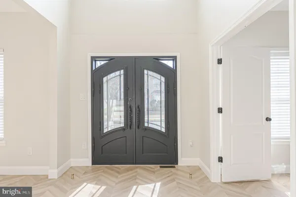 a bedroom with a bed and a mirror