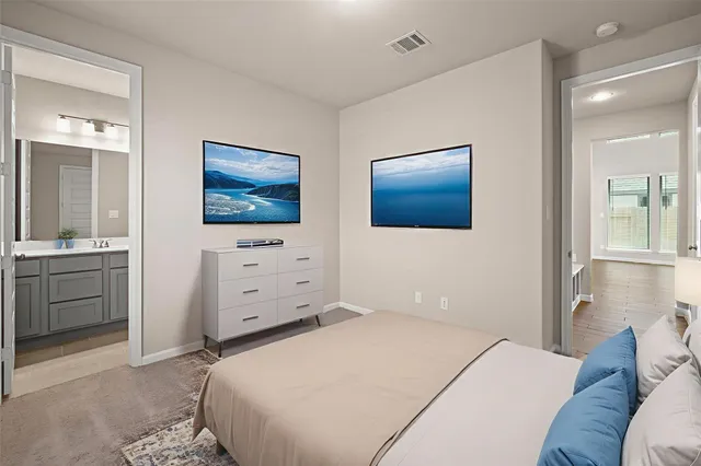 a bedroom with a bed and a cabinets