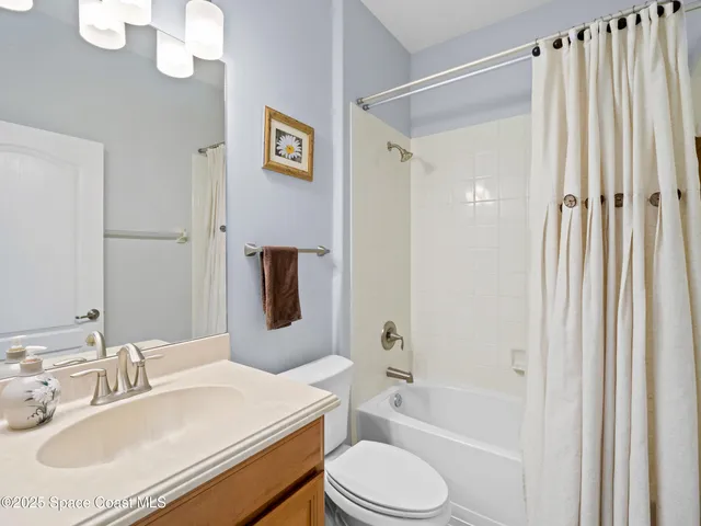 a bedroom with bed and a window