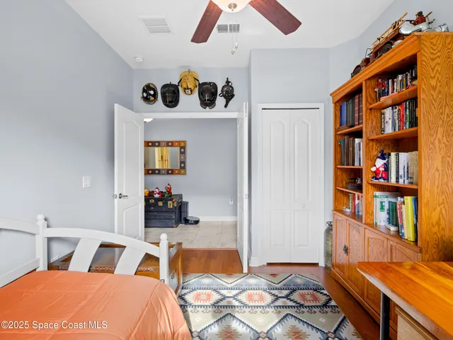 a work room with furniture and book shelf