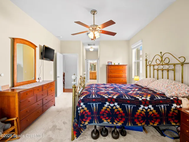 a bed room with a bed and a large window