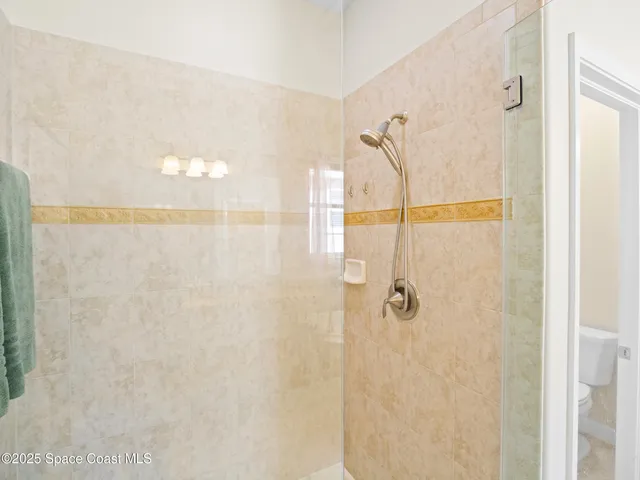 a room with furniture and large windows